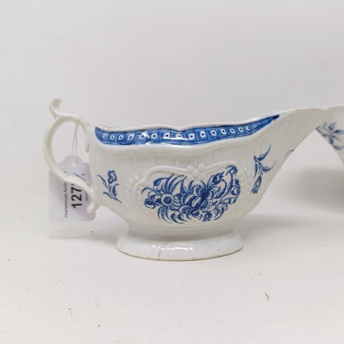 1273 - A pair of Worcester porcelain blue and white sauce boats, decorated flowers, open crescent mark to b... 