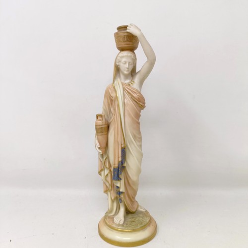 1258 - A Royal Worcester blush ivory classical figure holding an urn, 24 cm high