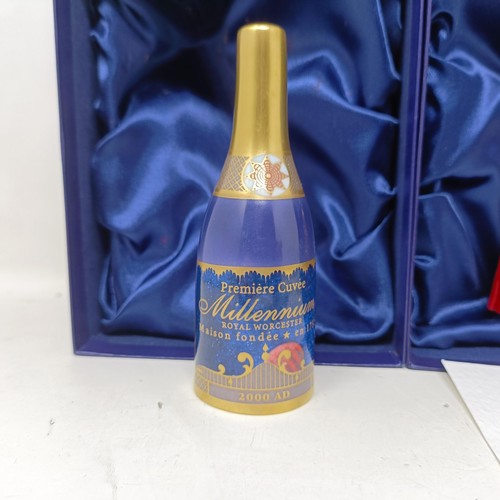 1257 - A Royal Worcester limited edition candle snuffer, in the form of a bottle of champagne, boxed, anoth... 