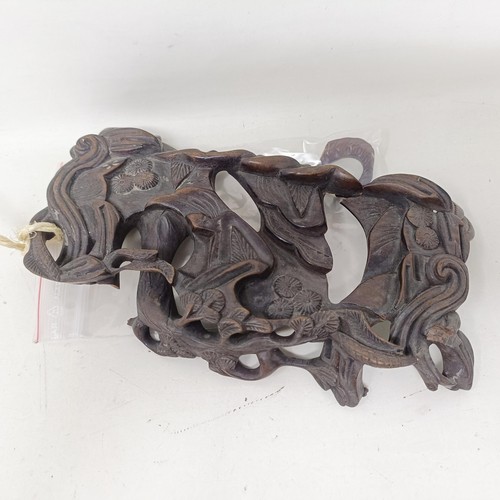 1325 - A pair of Chinese carved hardwood buffaloes, on stands, 24 cm wide