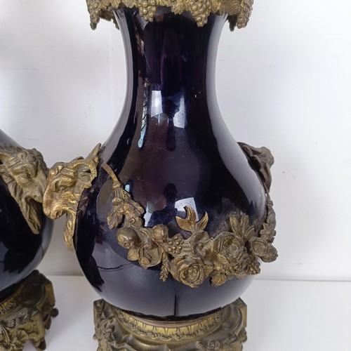 1304 - A pair of French blue glazed vases, with gilt metal mounts, converted to lamps, 52 cm high