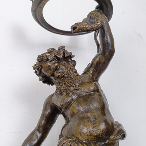 1305 - A Grand Tour style bronze stand, in the form of Bacchus holding a snake, 62 cm high