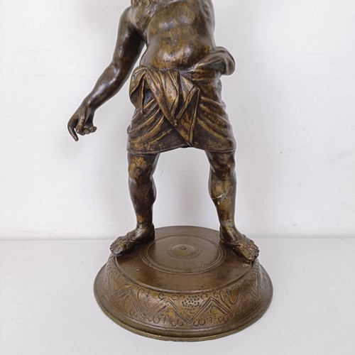 1305 - A Grand Tour style bronze stand, in the form of Bacchus holding a snake, 62 cm high