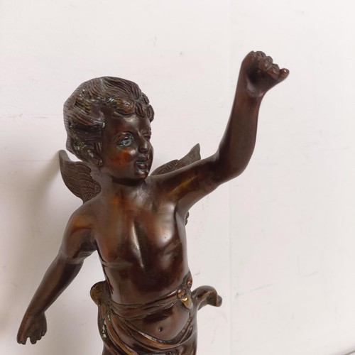 1307 - A bronze figure of a cherub, 35 cm high