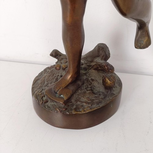 1307 - A bronze figure of a cherub, 35 cm high