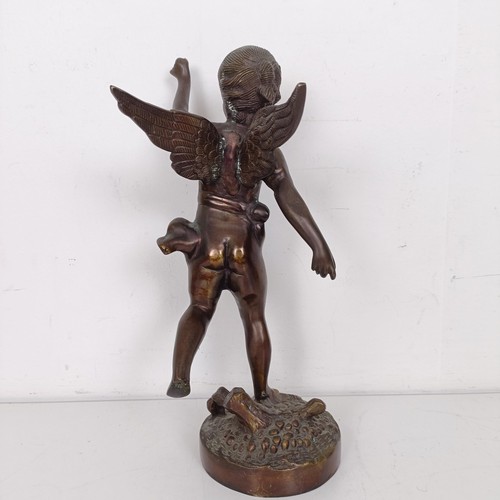 1307 - A bronze figure of a cherub, 35 cm high