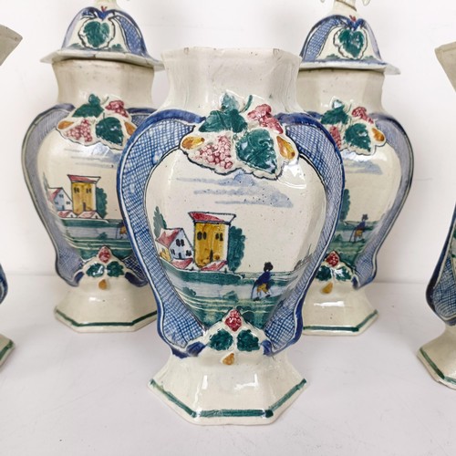 1298 - A Delft polychrome garniture, comprising two vases and covers and three vases