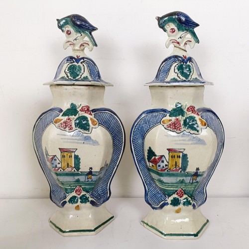 1298 - A Delft polychrome garniture, comprising two vases and covers and three vases