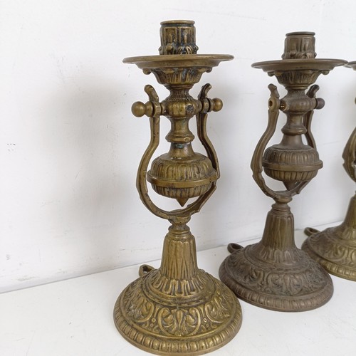 1314 - A set of four brass gimbal wall lights, 25 cm high