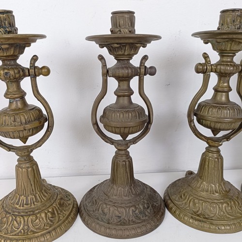 1314 - A set of four brass gimbal wall lights, 25 cm high