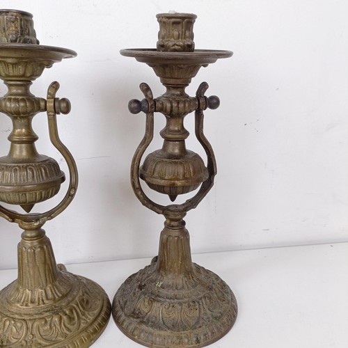 1314 - A set of four brass gimbal wall lights, 25 cm high