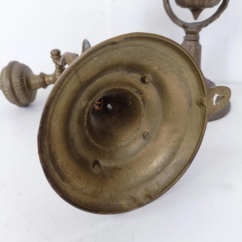 1314 - A set of four brass gimbal wall lights, 25 cm high