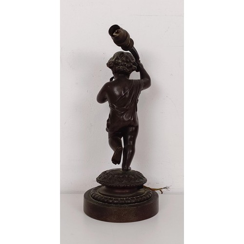 1208 - A bronze lamp base, in the form of a young child, on a circular base, 22 cm high