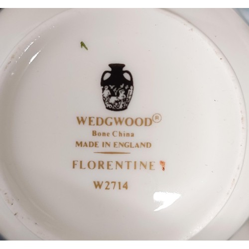 1215 - A Wedgwood Florentine pattern part dinner service (qty)