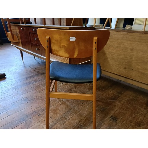 464 - A 1950s dining room suite, comprising a sideboard, four chairs and a drop leaf table (6)