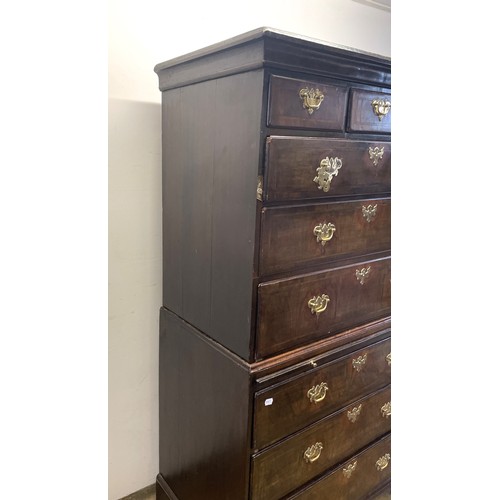 1353 - An 18th century walnut chest on chest, with three short drawers above three long drawers, on a base ... 