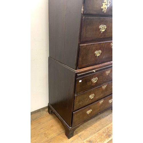 1353 - An 18th century walnut chest on chest, with three short drawers above three long drawers, on a base ... 