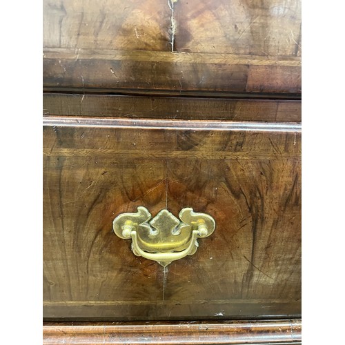 1353 - An 18th century walnut chest on chest, with three short drawers above three long drawers, on a base ... 