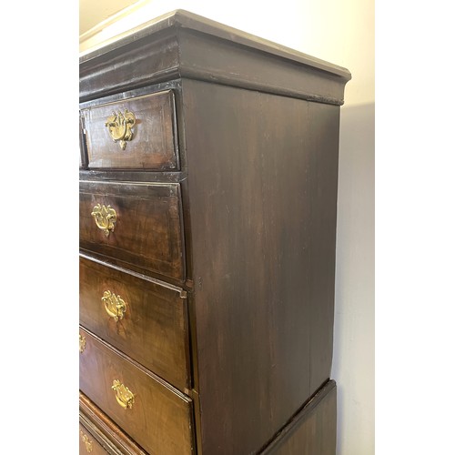 1353 - An 18th century walnut chest on chest, with three short drawers above three long drawers, on a base ... 