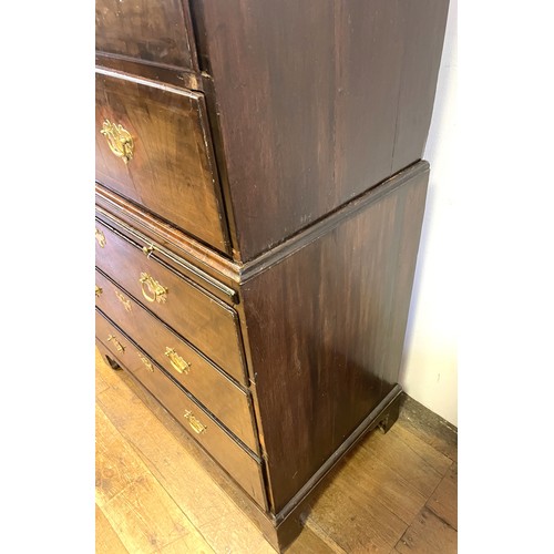 1353 - An 18th century walnut chest on chest, with three short drawers above three long drawers, on a base ... 