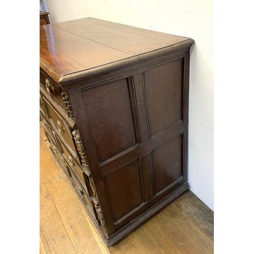 1352 - An oak chest, having four long drawers, 97 cm wide