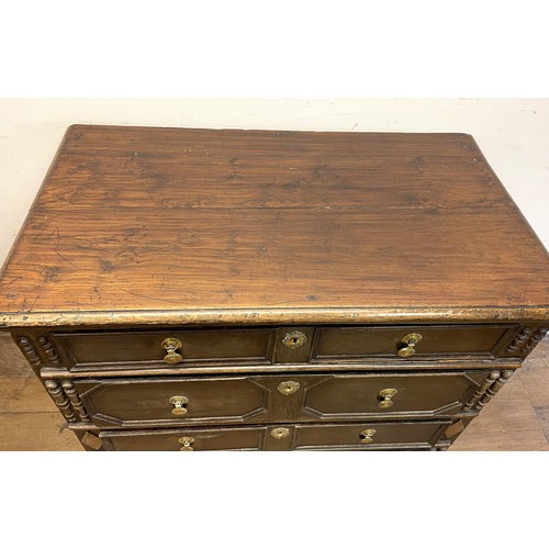 1352 - An oak chest, having four long drawers, 97 cm wide