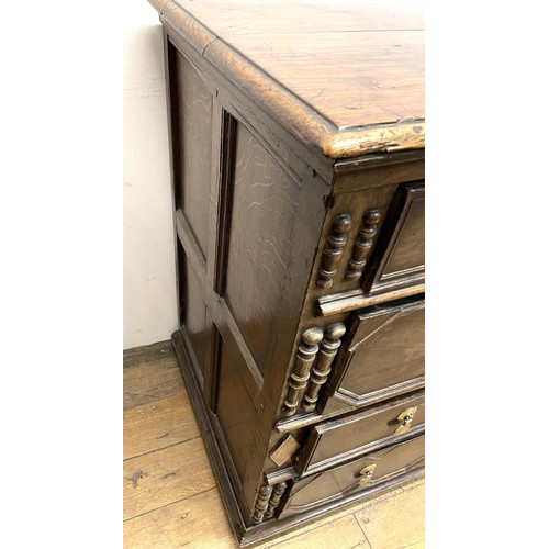 1352 - An oak chest, having four long drawers, 97 cm wide