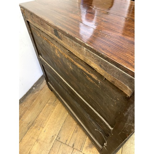 1352 - An oak chest, having four long drawers, 97 cm wide