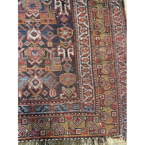 1503 - A Persian blue ground rug, 161 x 138 cm, a red ground prayer mat, 131 x 124 cm