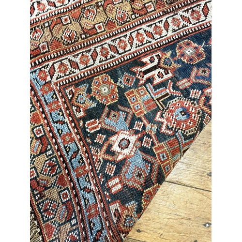 1503 - A Persian blue ground rug, 161 x 138 cm, a red ground prayer mat, 131 x 124 cm