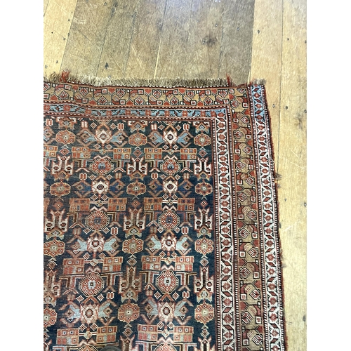 1503 - A Persian blue ground rug, 161 x 138 cm, a red ground prayer mat, 131 x 124 cm