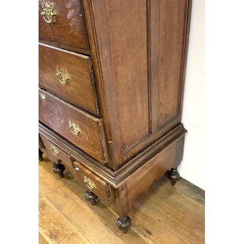 1359 - An oak chest on stand, the top having two short and four long drawers, on a base with three drawers,... 