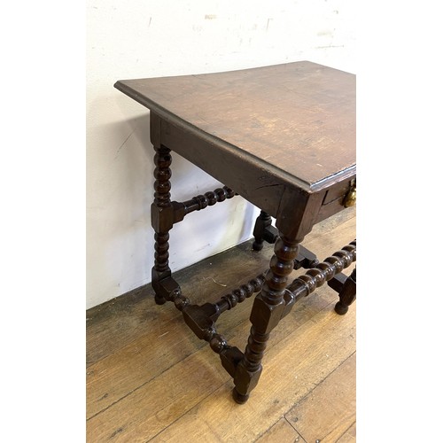 1367 - An oak side table, with a single drawer, on bobbin turned legs, 68 cm wide