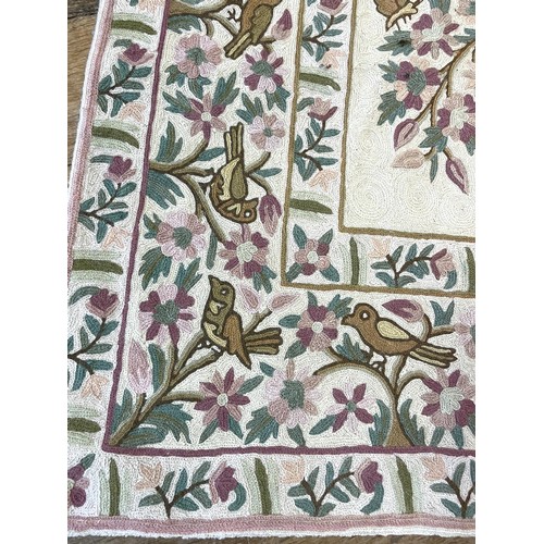 1505 - A crewelwork style rug, decorated flowers, 140 x 90 cm