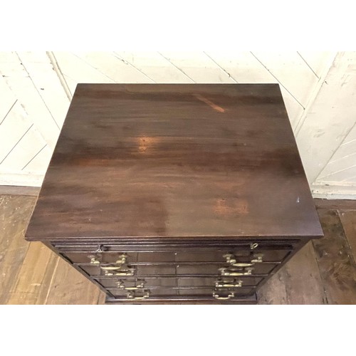 1417 - A mahogany chest, having a brushing slide and four long drawers, 55 cm wide