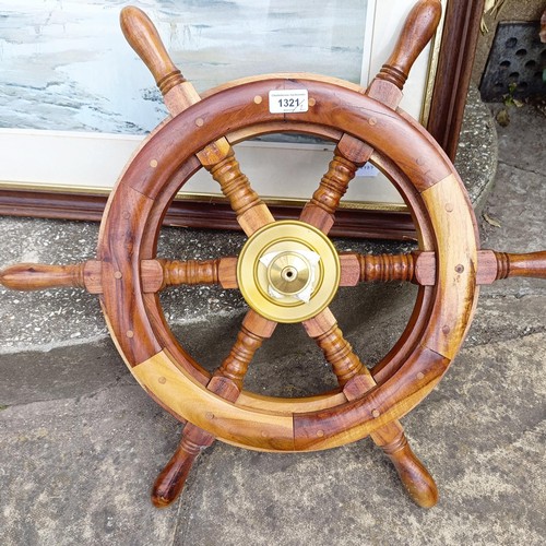 1321 - A replica ship's wheel, 65 cm diameter, a wall mirror, in a pine frame, 98 x 94 cm, and a print (3)