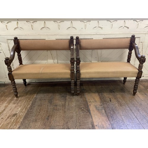 1375 - A pair of oak hall benches, with padded backs and seats, 105 cm wide (2)