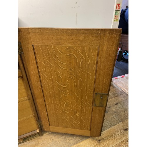 1405 - An oak estate cabinet, the two cupboard doors to reveal two slides and three drawers, 123 cm wide