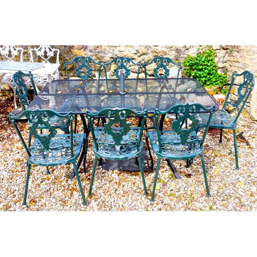 1493 - A metal garden table, the top 162 x 90 cm, a set of eight metal garden chairs and an umbrella stand