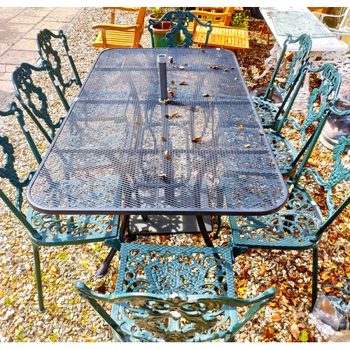 1493 - A metal garden table, the top 162 x 90 cm, a set of eight metal garden chairs and an umbrella stand