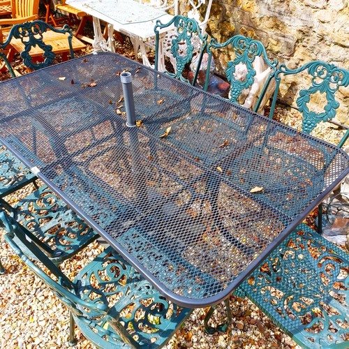 1493 - A metal garden table, the top 162 x 90 cm, a set of eight metal garden chairs and an umbrella stand