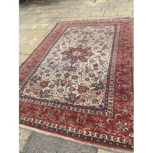 1534 - A Persian red ground carpet, 360 x 260 cm