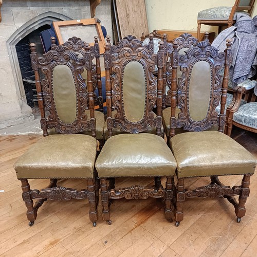 1459 - A set of seven carved oak high back dining chairs, with upholstered back and seats (6+1)