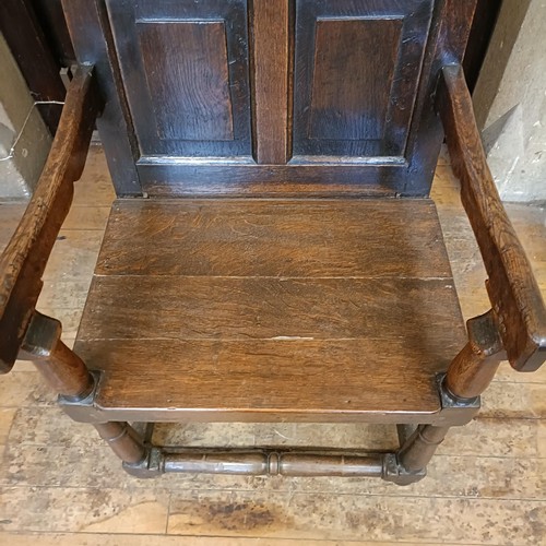 1456 - An oak wainscot type armchair, bearing a date 1755