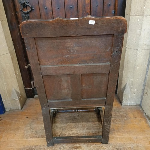 1456 - An oak wainscot type armchair, bearing a date 1755