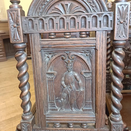 1430 - A set of oak dining chairs, with carved back decorated figures, and an oak sideboard (7)