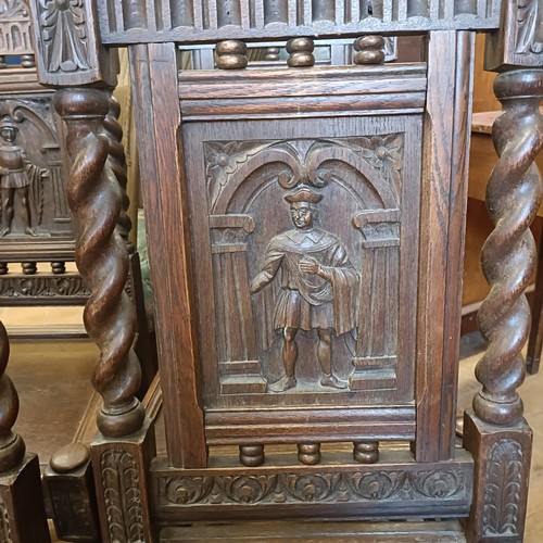 1430 - A set of oak dining chairs, with carved back decorated figures, and an oak sideboard (7)