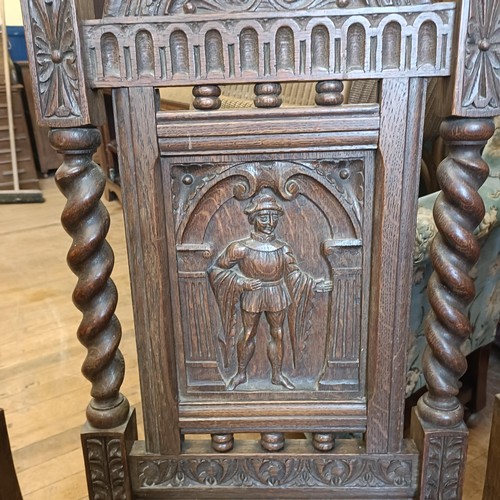 1430 - A set of oak dining chairs, with carved back decorated figures, and an oak sideboard (7)