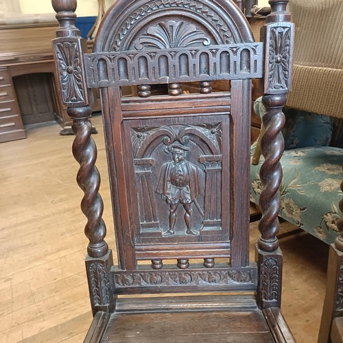 1430 - A set of oak dining chairs, with carved back decorated figures, and an oak sideboard (7)