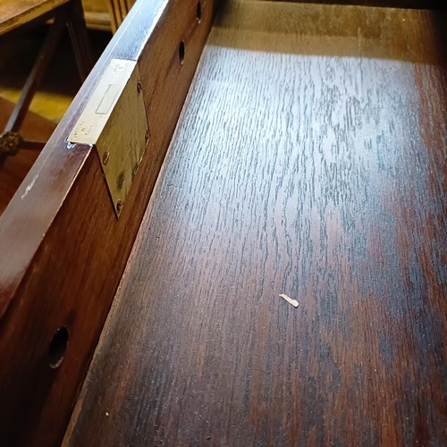 1381 - An 18th century style mahogany bureau, 66 cm wide, and a pair of mahogany two tier tables (3)